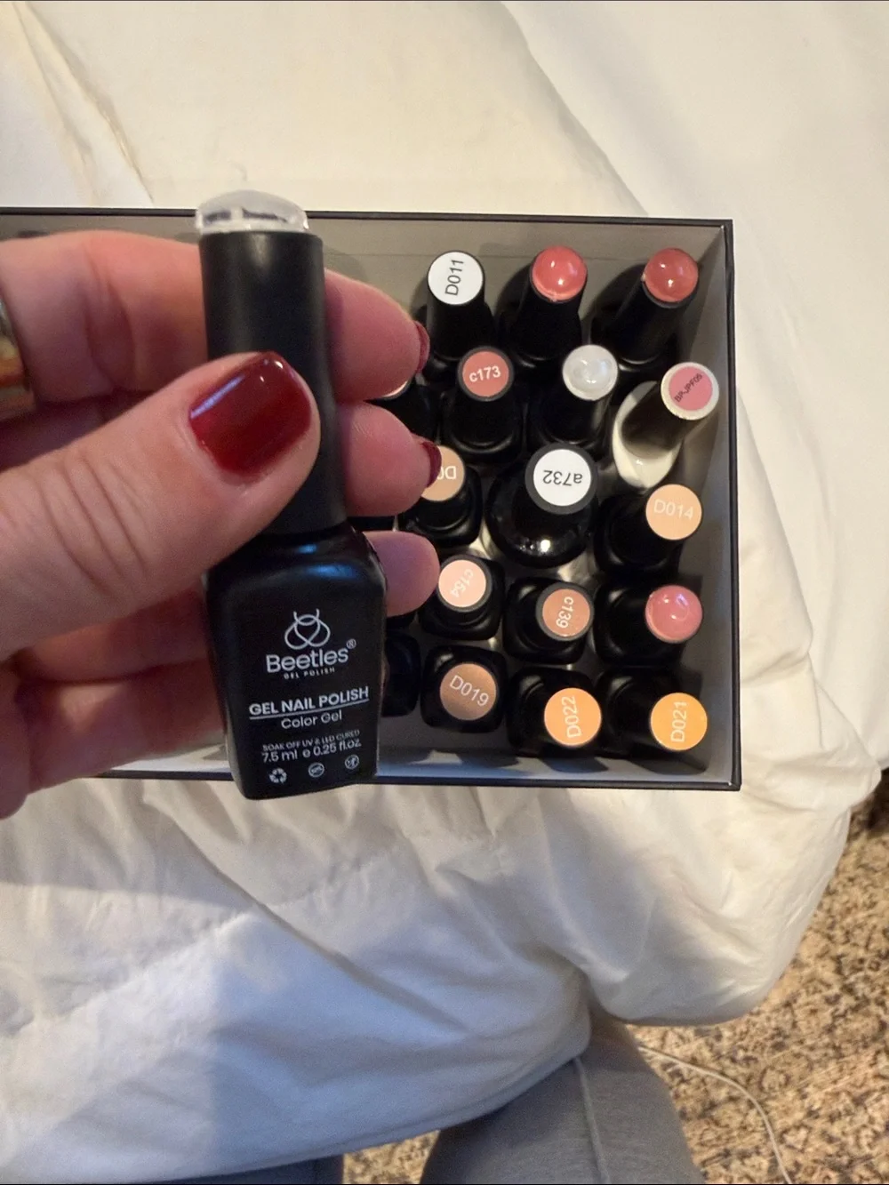 Collection of gel, nail polishes. Mostly light neutrals and dark neutrals.
